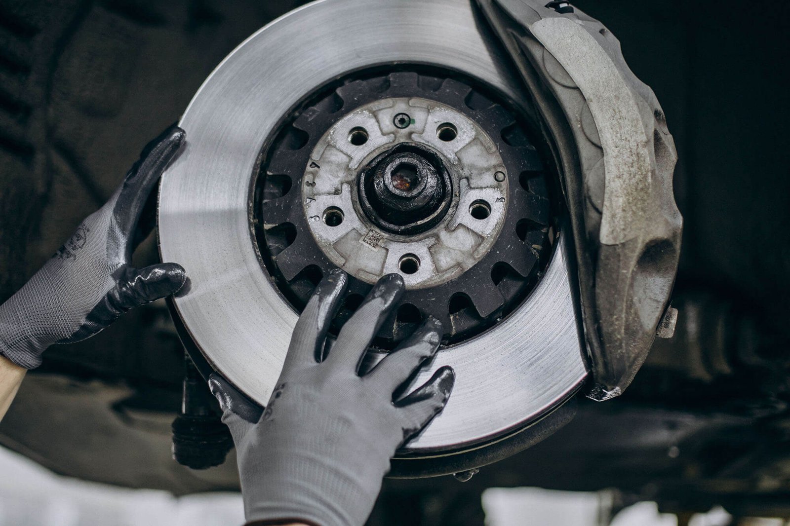 mechanic-changing-brake-discs-car-service.jpg